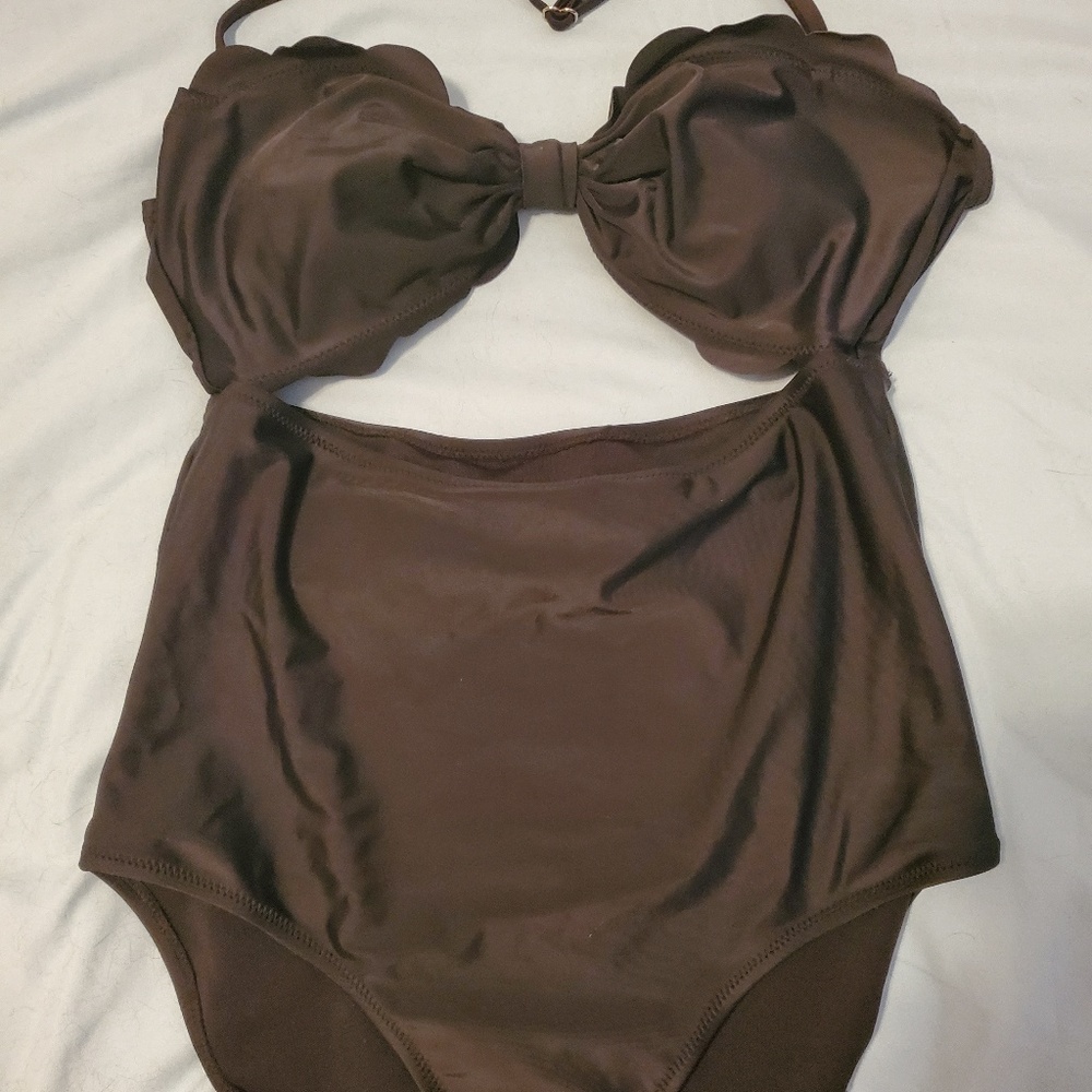 Never worn scalloped cut-out one piece suit